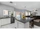 Open kitchen features a large island, stainless steel appliances, and pool view at 5310 Esparon Ave, Las Vegas, NV 89141