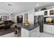 Spacious kitchen with island, stainless steel appliances, and white cabinetry at 5310 Esparon Ave, Las Vegas, NV 89141