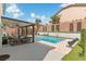 Relaxing pool area with patio furniture and a pergola at 5310 Esparon Ave, Las Vegas, NV 89141