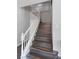 Elegant staircase with dark wood treads and white railings at 5310 Esparon Ave, Las Vegas, NV 89141