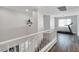 Upstairs hallway with dark hardwood flooring and treadmill at 5310 Esparon Ave, Las Vegas, NV 89141