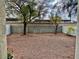 Backyard with gravel landscaping and mature trees, offering a private outdoor space at 6225 Dan Blocker Ave # 102, Henderson, NV 89011