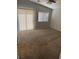 Bright bedroom features vaulted ceilings, neutral carpet, and a large window with sliding door at 6225 Dan Blocker Ave # 102, Henderson, NV 89011