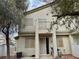 Exterior of a two-story home features a balcony and patio space at 6225 Dan Blocker Ave # 102, Henderson, NV 89011