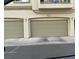Two-car garage with neutral doors offers convenient parking and storage at 6225 Dan Blocker Ave # 102, Henderson, NV 89011
