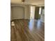 Bright, open-concept living space features hardwood floors and a ceiling fan at 6225 Dan Blocker Ave # 102, Henderson, NV 89011