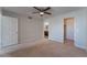 Bright bedroom with ceiling fan, ensuite bathroom access, and large closet at 6800 E Lake Mead Blvd # 2035, Las Vegas, NV 89156