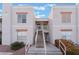 Two-story building exterior with stairs and landscaping at 6800 E Lake Mead Blvd # 2035, Las Vegas, NV 89156