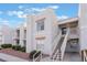 Two-story building exterior with stairs and landscaping at 6800 E Lake Mead Blvd # 2035, Las Vegas, NV 89156