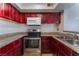 Kitchen with dark wood cabinets and granite countertops at 6800 E Lake Mead Blvd # 2035, Las Vegas, NV 89156