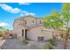 Beautiful two-story home with desert landscaping, tiled roof, and a two-car garage at 8719 Rio Andir Ave, Las Vegas, NV 89148