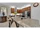 Modern kitchen features an oversized island, stainless steel appliances, and dark wood cabinets at 8719 Rio Andir Ave, Las Vegas, NV 89148