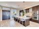 Modern kitchen with island and stainless steel appliances at 8925 W Flamingo Rd # 216, Las Vegas, NV 89147