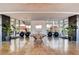 Elegant lobby with a wood table and potted plants at 8925 W Flamingo Rd # 216, Las Vegas, NV 89147