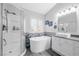 Bright bathroom featuring a standalone tub, walk-in shower, and modern vanity at 9578 Teton Vista Ave, Las Vegas, NV 89117