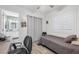 Bedroom with desk, ceiling fan, hardwood floors, and an ensuite bathroom at 9578 Teton Vista Ave, Las Vegas, NV 89117