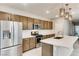 Modern kitchen with stainless steel appliances and island at 11297 Hidden Peak Ave # 102, Las Vegas, NV 89135