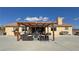 Expansive backyard featuring a pergola covered seating area, ideal for outdoor gatherings at 1771 Labrador St, Pahrump, NV 89048