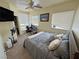 Bedroom with ceiling fan and multiple windows at 1771 Labrador St, Pahrump, NV 89048
