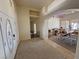 Bright entryway featuring tiled floors, decorative glass doors, and a view into the living space at 1771 Labrador St, Pahrump, NV 89048