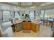Lovely kitchen island with stone counter top and a view of the living room at 1771 Labrador St, Pahrump, NV 89048