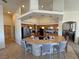 Spacious kitchen island featuring pendant lighting and bar stool seating at 1771 Labrador St, Pahrump, NV 89048