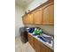 Functional laundry room with lots of storage and side by side washer and dryer at 1771 Labrador St, Pahrump, NV 89048