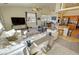 Inviting open-concept living room featuring a large sectional couch and kitchen bar seating at 1771 Labrador St, Pahrump, NV 89048