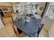 Open-concept living space with a view of the kitchen and multiple windows at 1771 Labrador St, Pahrump, NV 89048