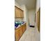 Practical mud room with ample cabinet space and a utility sink at 1771 Labrador St, Pahrump, NV 89048