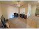 Home office area featuring carpet floors, natural light, and a view into the entryway at 1771 Labrador St, Pahrump, NV 89048