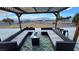 Outdoor patio showcasing a cozy seating area with a fire pit, perfect for entertaining or relaxing at 1771 Labrador St, Pahrump, NV 89048