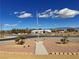 Community street view showcasing a well-kept landscape, complete with greenery and signage at 1771 Labrador St, Pahrump, NV 89048