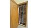 Close-up of plumbing manifold in wood cabinet at 1771 Labrador St, Pahrump, NV 89048