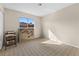 Bedroom with neutral walls, patterned carpet, and a window for natural light at 204 Cimarron Ct, Henderson, NV 89002