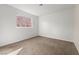 Carpeted bedroom featuring white walls and window providing natural lighting at 204 Cimarron Ct, Henderson, NV 89002