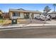 Charming single-story home featuring low maintenance landscaping and a paved driveway leading to an attached garage at 204 Cimarron Ct, Henderson, NV 89002