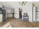 Spacious eat-in kitchen featuring tile floors, white cabinetry, and functional layout at 204 Cimarron Ct, Henderson, NV 89002