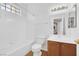 Bright bathroom with shower over tub and single sink vanity at 2050 W Warm Springs Rd # 3322, Henderson, NV 89014