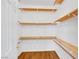 Walk-in closet with wood shelving and wood-look floors at 2050 W Warm Springs Rd # 3322, Henderson, NV 89014