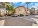 Multi-story home exterior showing lush landscaping and a paver driveway at 2050 W Warm Springs Rd # 3322, Henderson, NV 89014