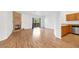 Bright living room featuring a cozy fireplace, hardwood floors, and sliding glass doors to the balcony at 2050 W Warm Springs Rd # 3322, Henderson, NV 89014