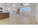 Bright and airy living room featuring white walls, light wood flooring, and modern fixtures at 2220 Patriotic Ln, North Las Vegas, NV 89032