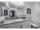 Bright bathroom with a vanity, granite countertop, and shower-tub combination at 2681 Tuxedo Black Ct, North Las Vegas, NV 89086