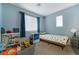 Charming bedroom with playful decor, a twin bed, and ample sunlight at 2681 Tuxedo Black Ct, North Las Vegas, NV 89086