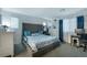 Spacious main bedroom with a large bed, tufted headboard, and natural light at 2681 Tuxedo Black Ct, North Las Vegas, NV 89086