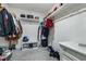 Organized walk-in closet with shelving, hanging rods, and ample storage space at 2681 Tuxedo Black Ct, North Las Vegas, NV 89086