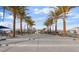 A beautiful, tree-lined walkway in a community park, enhanced with comfortable seating at 2681 Tuxedo Black Ct, North Las Vegas, NV 89086