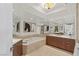 Luxury bathroom features a soaking tub, double vanities, and mirrored walls for a spa-like experience at 2777 Paradise Rd # 1105, Las Vegas, NV 89109
