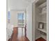 Serene bedroom featuring a walk-in closet, hardwood floors, and a balcony offering city views at 2777 Paradise Rd # 1105, Las Vegas, NV 89109